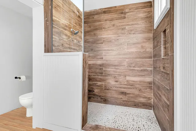 a kitchen with stainless steel appliances a stove a sink and a refrigerator