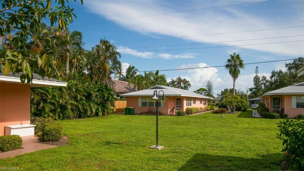 524 97th Avenue North, Unit B Naples, FL 34108 - Photo 11 of 13 a house view with a garden space