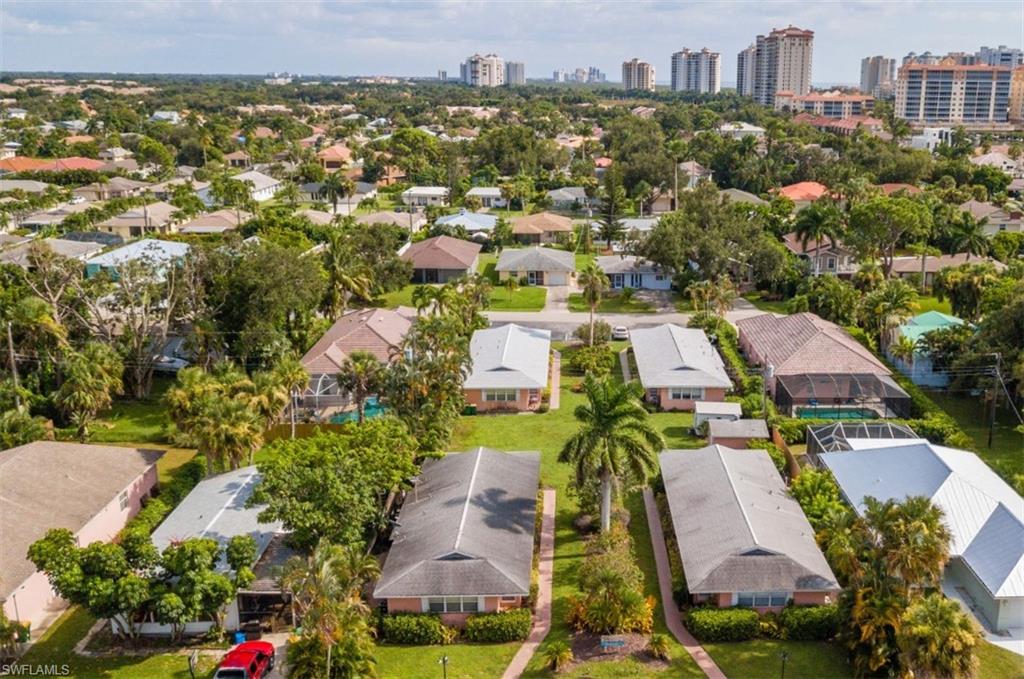 524 97th Avenue North, Unit B Naples, FL 34108 - Photo 12 of 13 an aerial view of residential houses with outdoor space