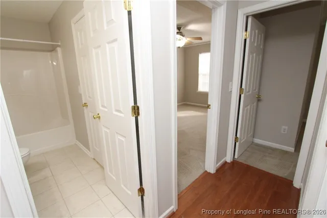 a view of a bathroom from a hallway