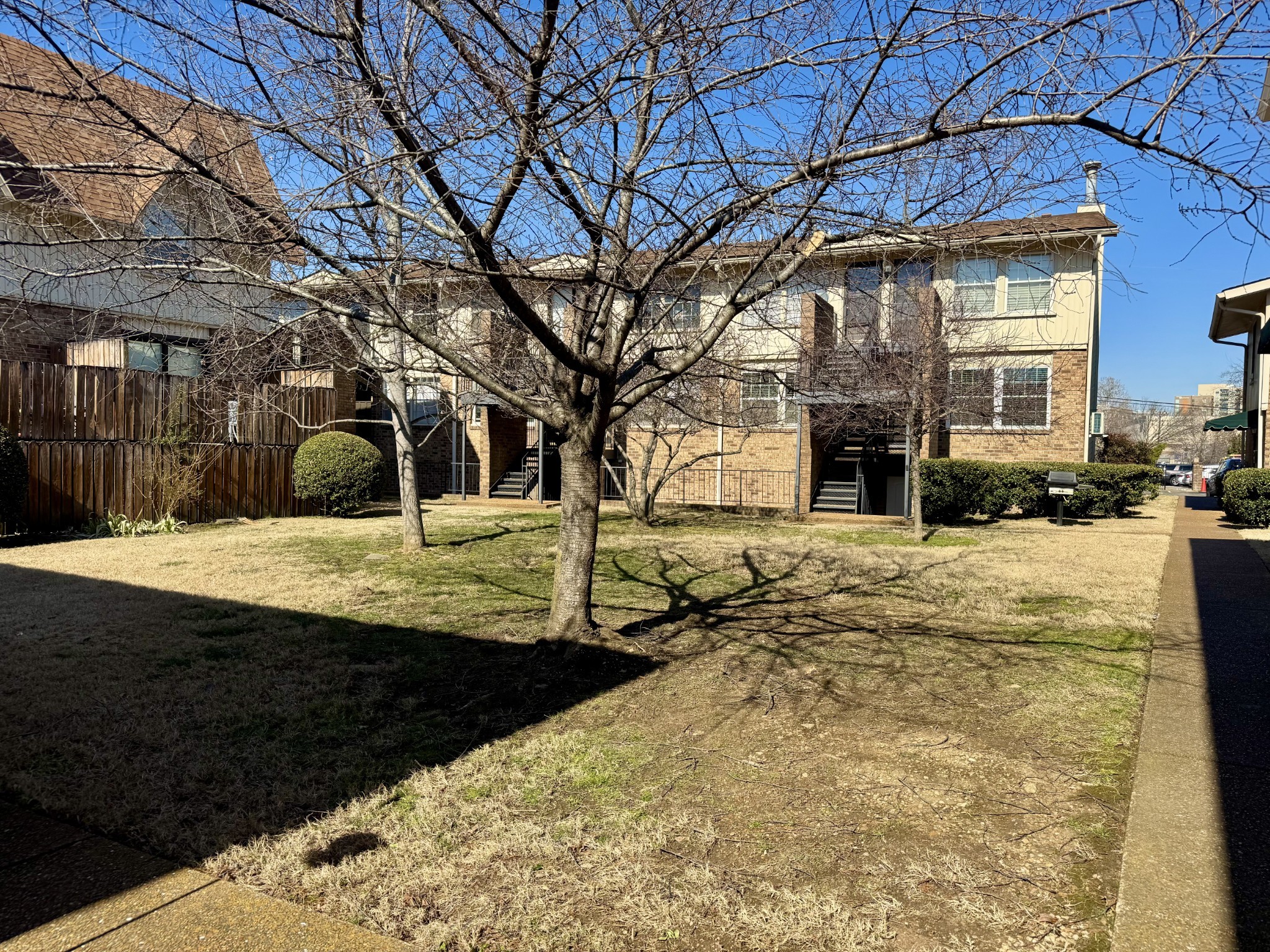 2116 Hobbs Road, Unit J9 Nashville, TN 37215 - Photo 13 of 17 a view of a yard with a tree