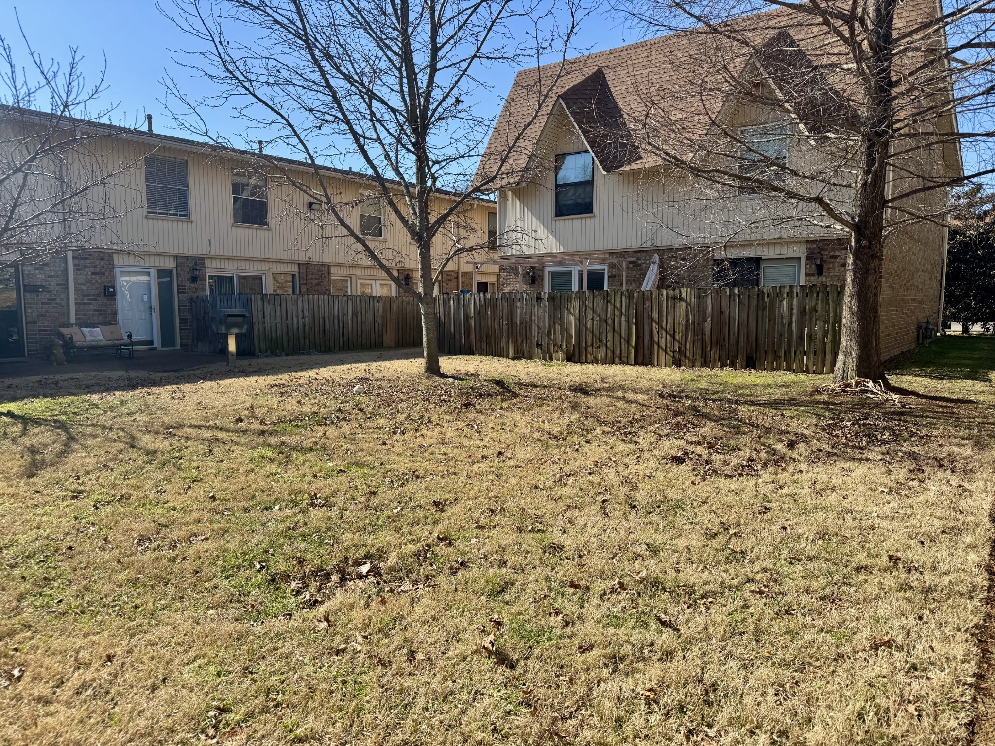 2116 Hobbs Road, Unit J9 Nashville, TN 37215 - Photo 14 of 17 a big house with tree in front of it