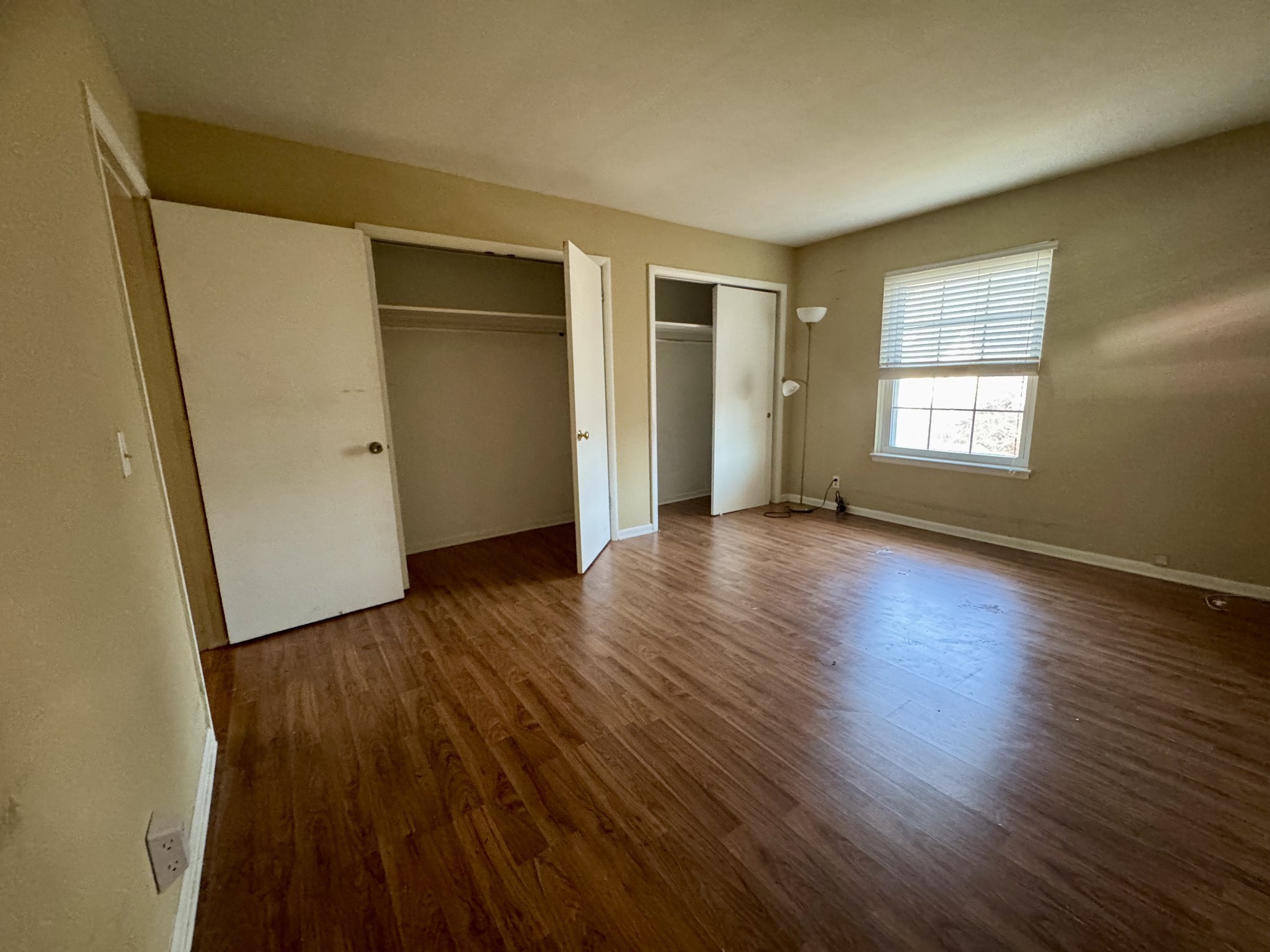 2116 Hobbs Road, Unit J9 Nashville, TN 37215 - Photo 9 of 17 an empty room with wooden floor and windows