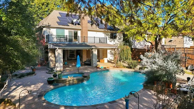 a view of a house with backyard porch and sitting area