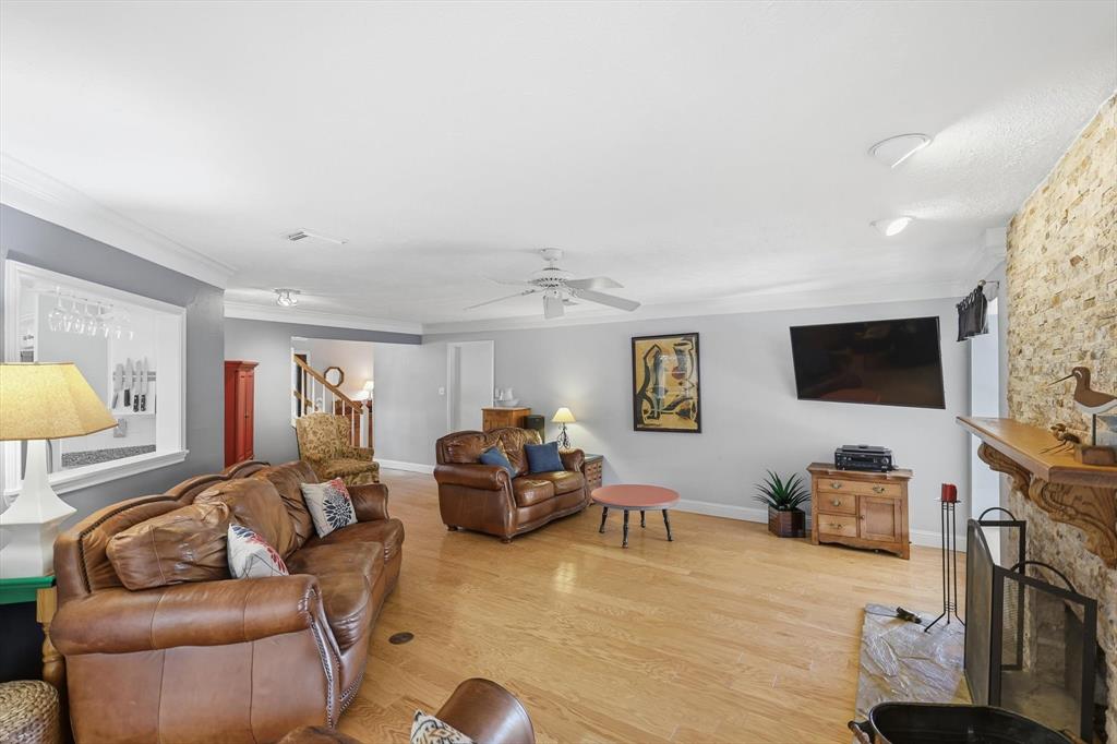 7608 Tallow Road Irving, TX 75063 - Photo 15 of 40 a living room with furniture and a flat screen tv