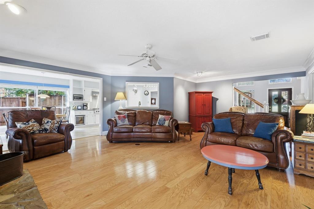 7608 Tallow Road Irving, TX 75063 - Photo 16 of 40 a living room with furniture and a glass door