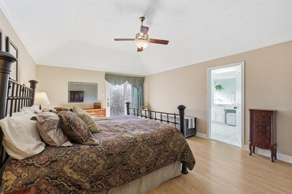 7608 Tallow Road Irving, TX 75063 - Photo 20 of 40 a bedroom with a bed and a dresser