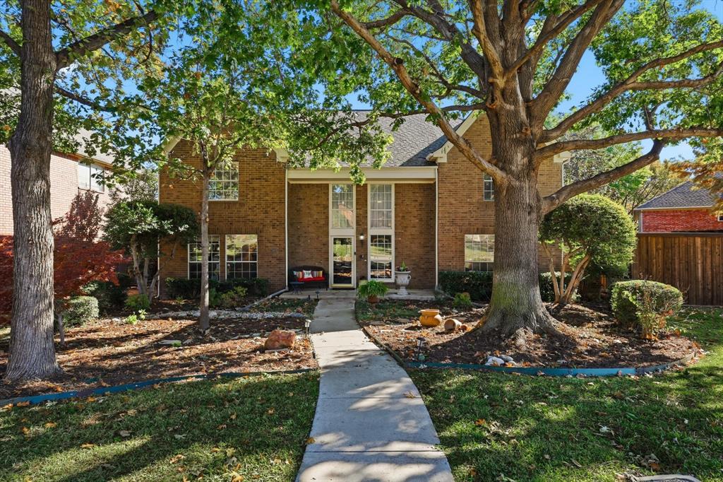 7608 Tallow Road Irving, TX 75063 - Photo 2 of 40 a view of a patio with table and chairs potted plants and large tree
