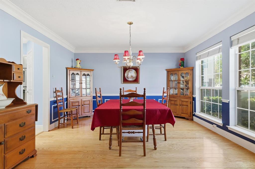 7608 Tallow Road Irving, TX 75063 - Photo 8 of 40 a view of a dining room with furniture and chandelier