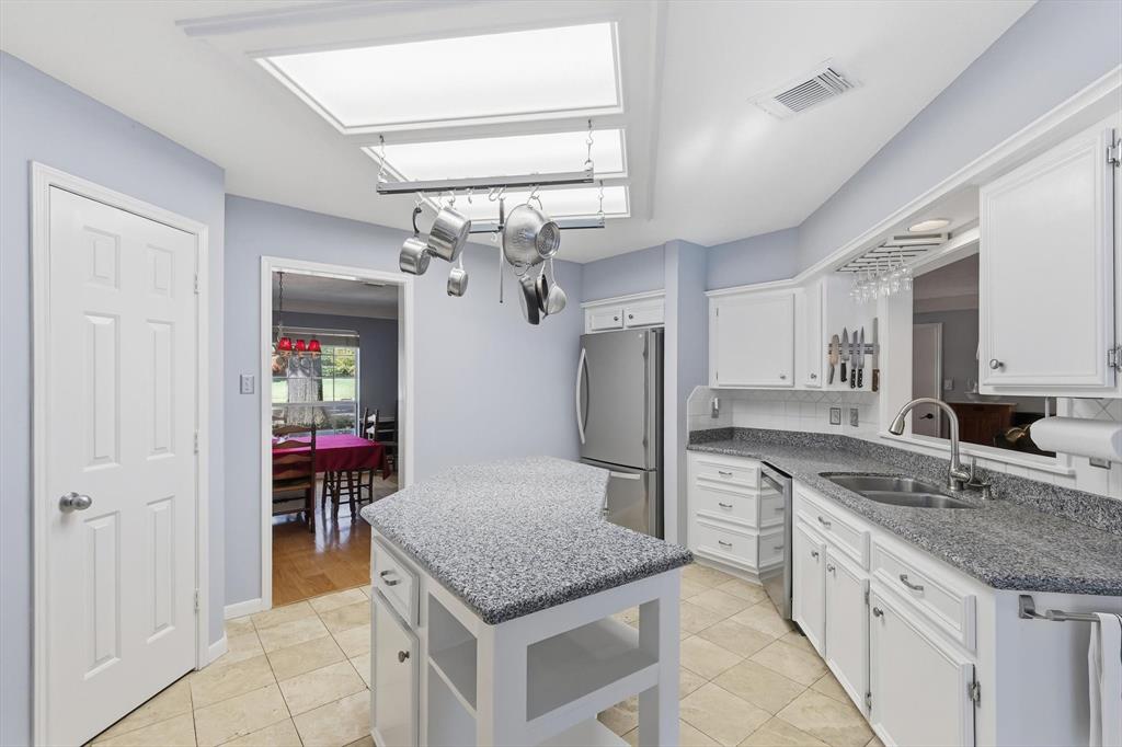 7608 Tallow Road Irving, TX 75063 - Photo 9 of 40 a kitchen with stainless steel appliances granite countertop a sink and refrigerator