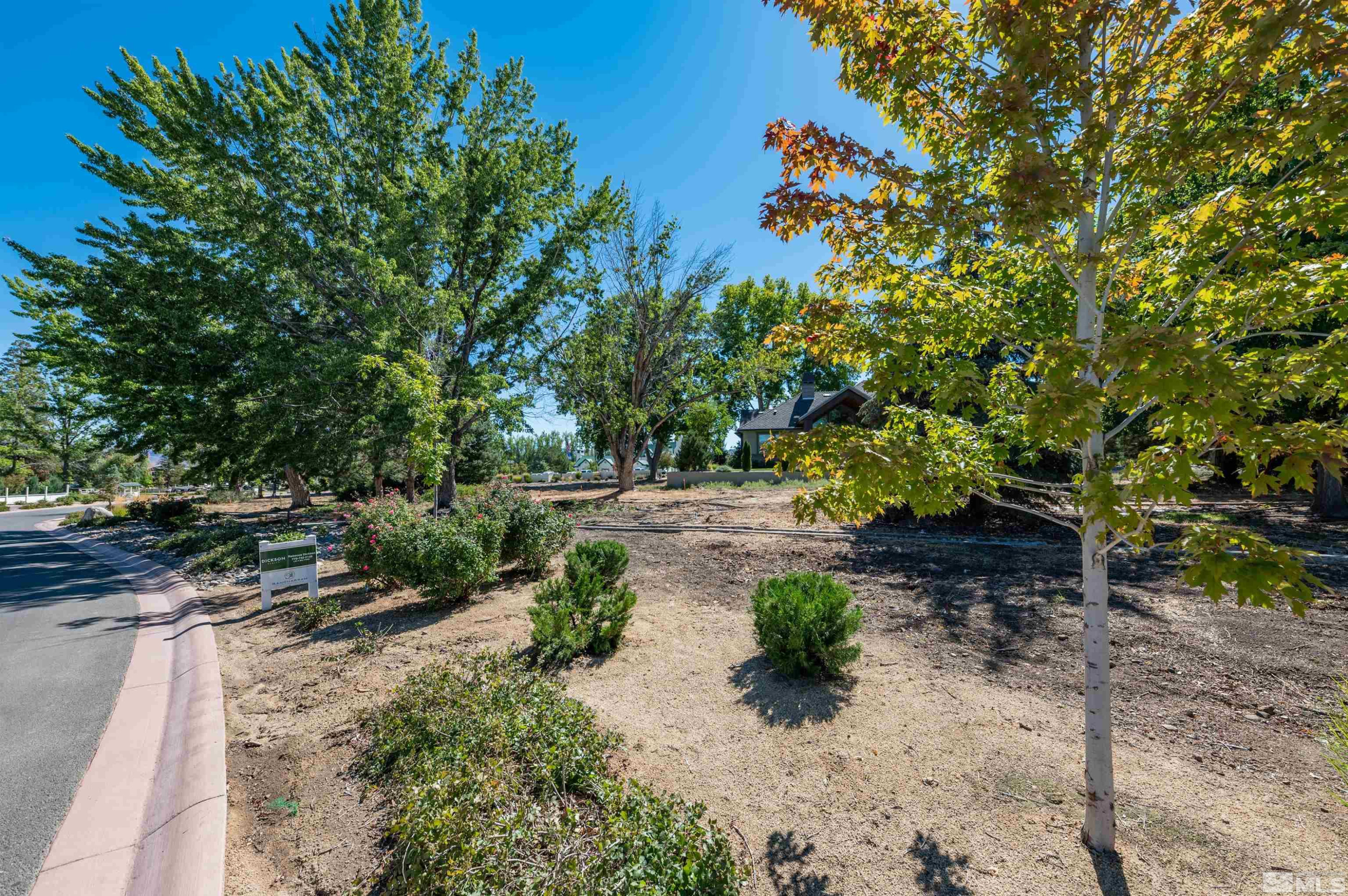 6119 Rancharrah Parkway, Unit LOT 12 Reno, NV 89511 - Photo 5 of 14 a backyard of a house with lots of green space