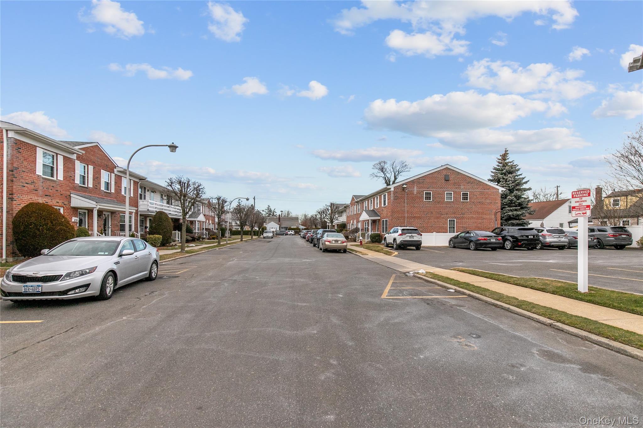 676 Front Street, Unit F Hempstead, NY 11550 - Photo 15 of 18 a view of a street with cars