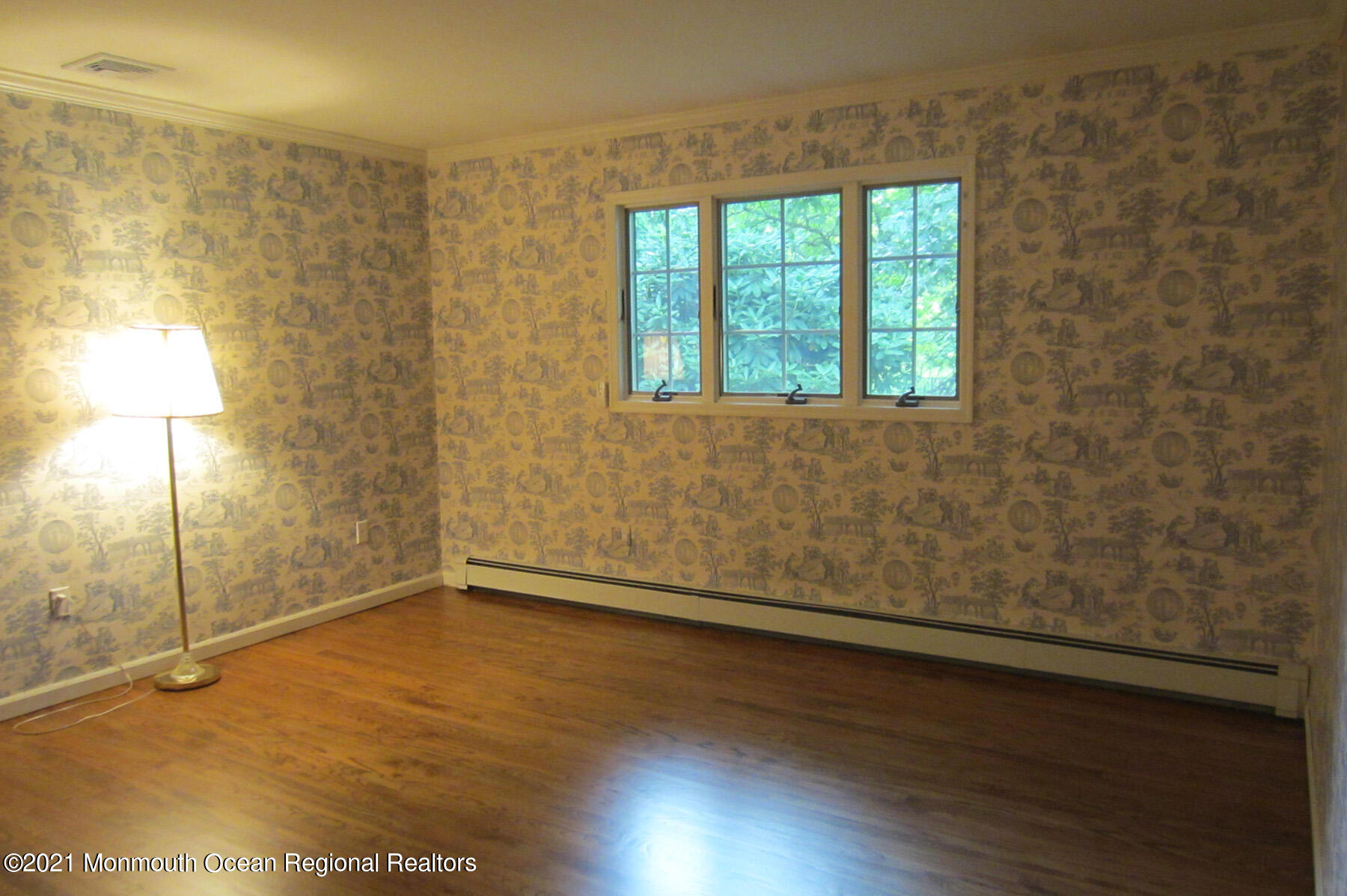24 Beaver Dam Road Colts Neck, NJ 07722 - Photo 14 of 31 an empty room with wooden floor and windows