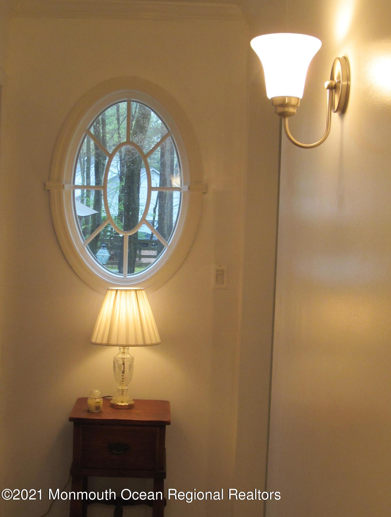 24 Beaver Dam Road Colts Neck, NJ 07722 - Photo 17 of 31 an empty room with a chandelier fan and wooden floor