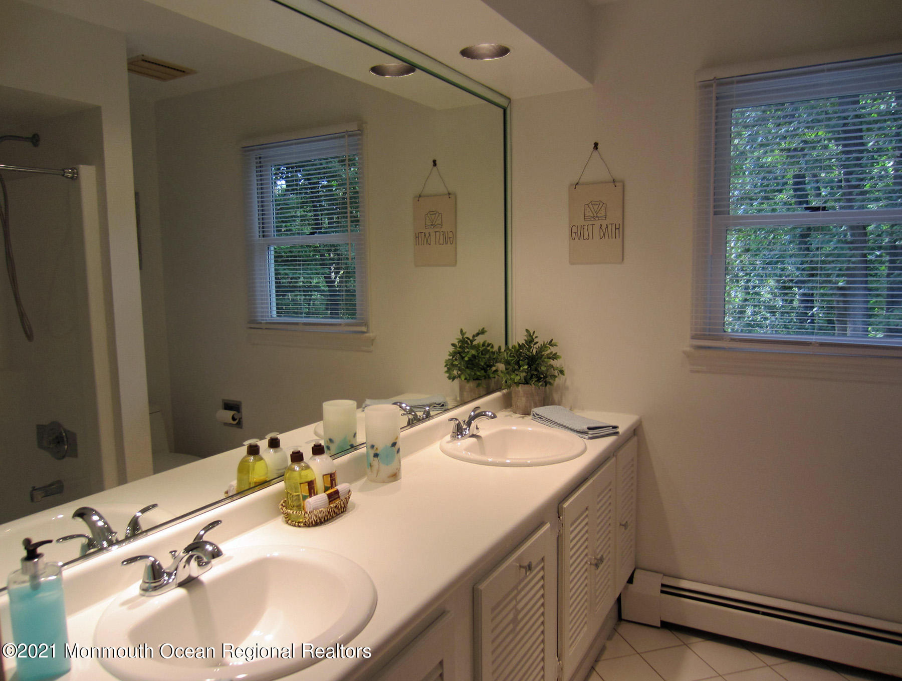 24 Beaver Dam Road Colts Neck, NJ 07722 - Photo 19 of 31 a bathroom with a sink and a mirror