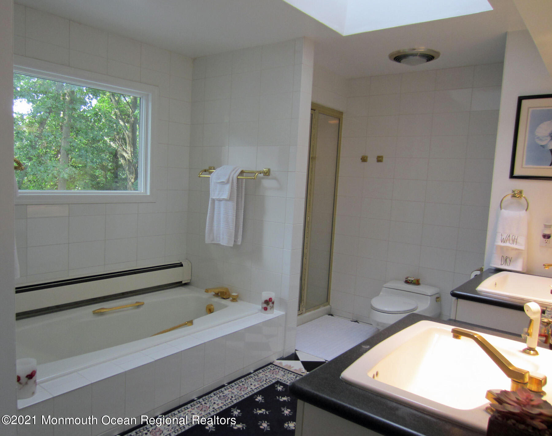 24 Beaver Dam Road Colts Neck, NJ 07722 - Photo 20 of 31 a bathroom with a bathtub a sink and a toilet