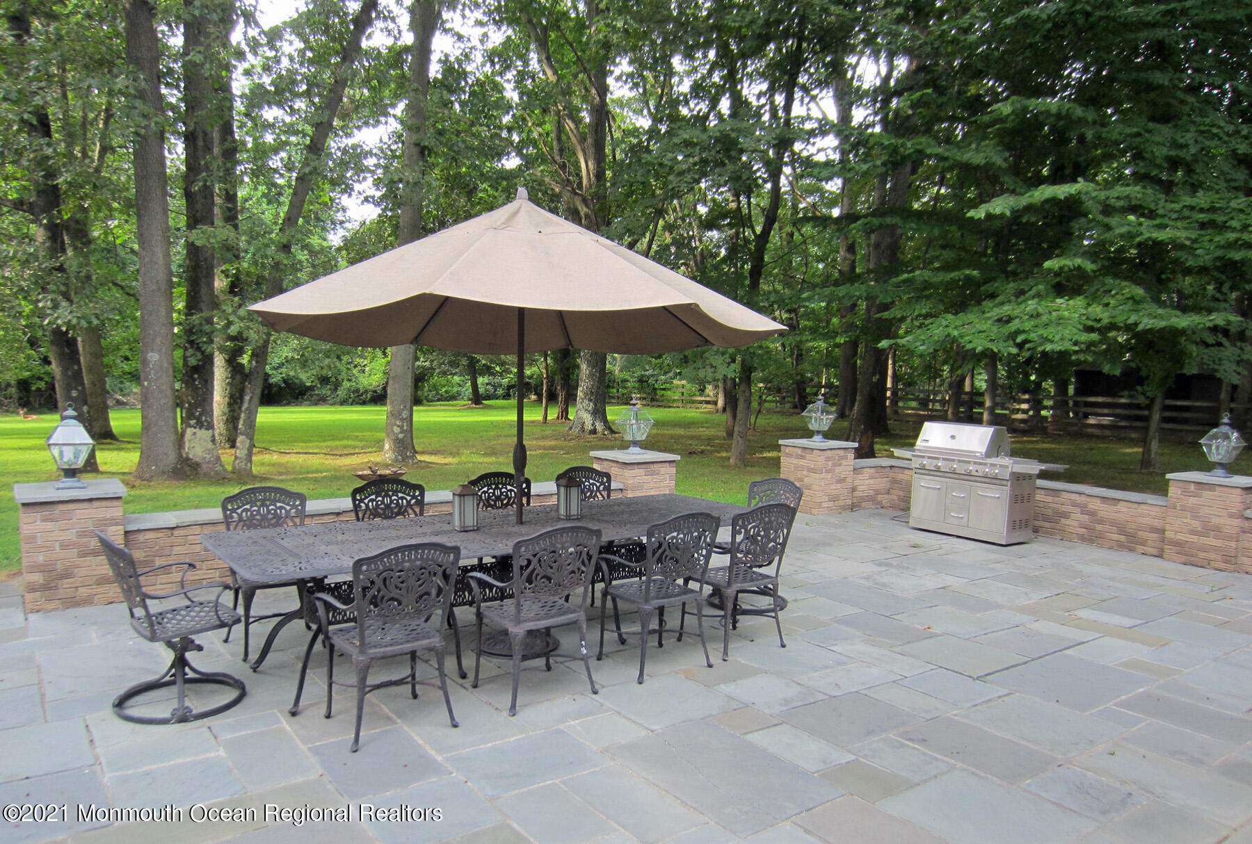 24 Beaver Dam Road Colts Neck, NJ 07722 - Photo 23 of 31 a view of backyard with outdoor seating a patio and outdoor seating