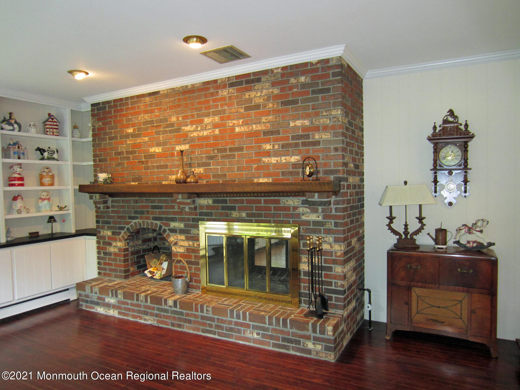 24 Beaver Dam Road Colts Neck, NJ 07722 - Photo 7 of 31 a living room with furniture and a fireplace