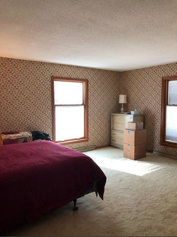 990 West Pines Road Oregon, IL 61061 - Photo 11 of 24 a spacious bedroom with a bed and window