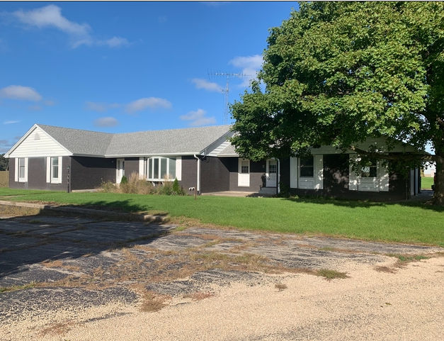 990 West Pines Road Oregon, IL 61061 - Photo 17 of 24 a front view of a house with a yard
