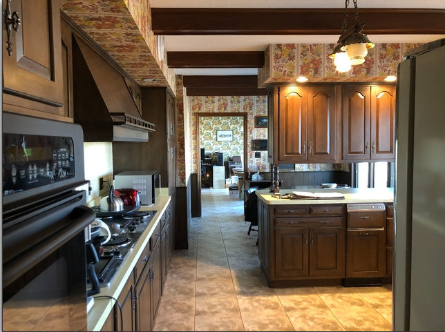 990 West Pines Road Oregon, IL 61061 - Photo 4 of 24 a kitchen with a stove and a sink