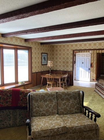 990 West Pines Road Oregon, IL 61061 - Photo 9 of 24 a living room with furniture and a large window