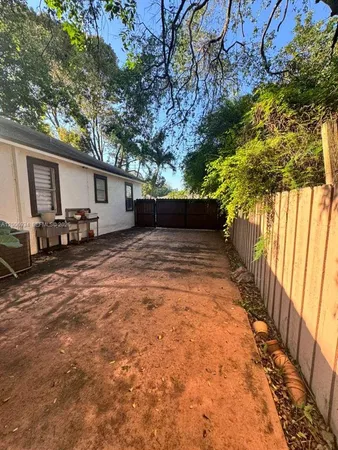 a view of a backyard with a patio