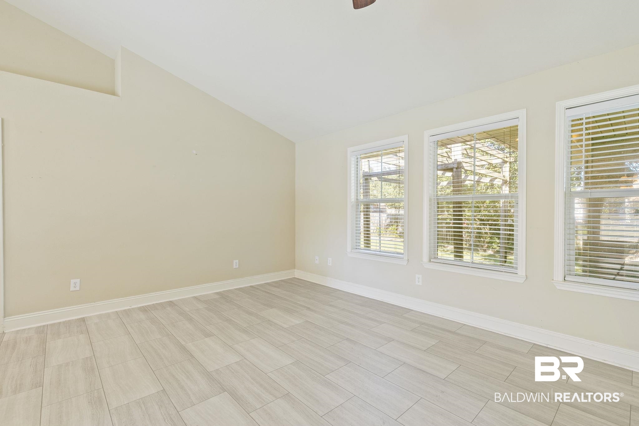 11153 Sturbridge Loop Daphne, AL 36526 - Photo 27 of 79 Empty room with light hardwood / wood-style flooring, ceiling fan, and lofted ceiling