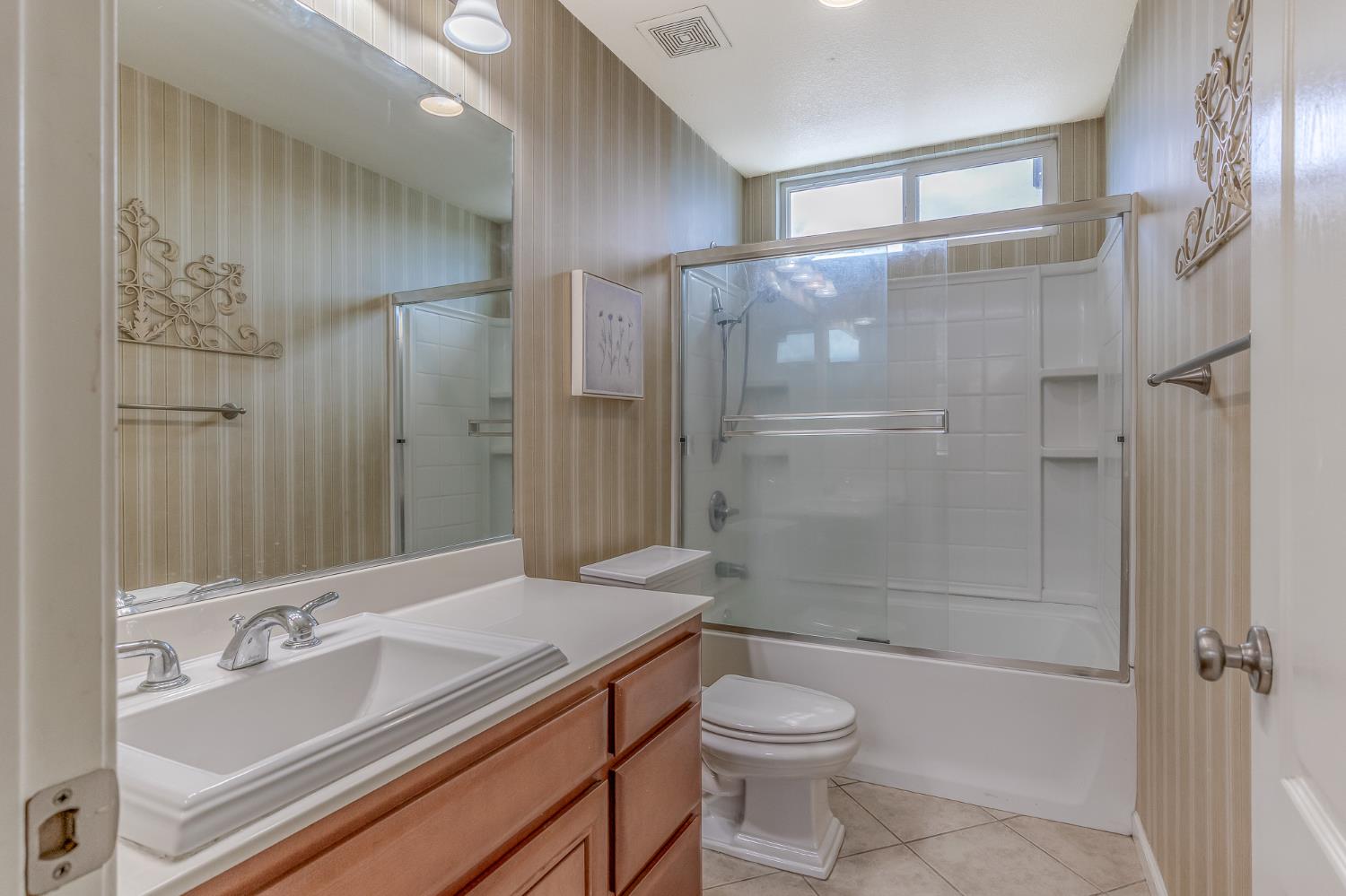 188 Thomsen Road Lathrop, CA 95330 - Photo 17 of 27 a bathroom with a bathtub shower sink vanity and toilet