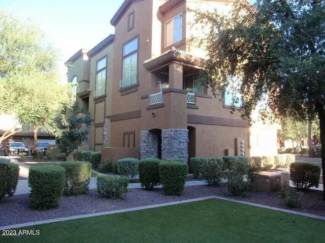 a view of a building with a yard