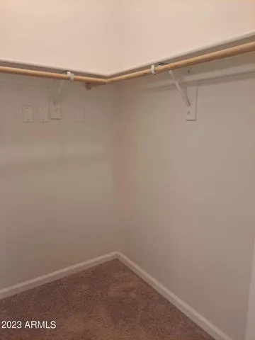 a view of a room with shelf on the wall