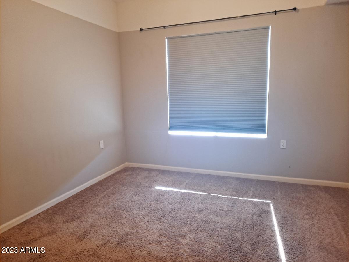 1920 East Bell Road, Unit 1114 Phoenix, AZ 85022 - Photo 15 of 18 a view of an empty room with a window