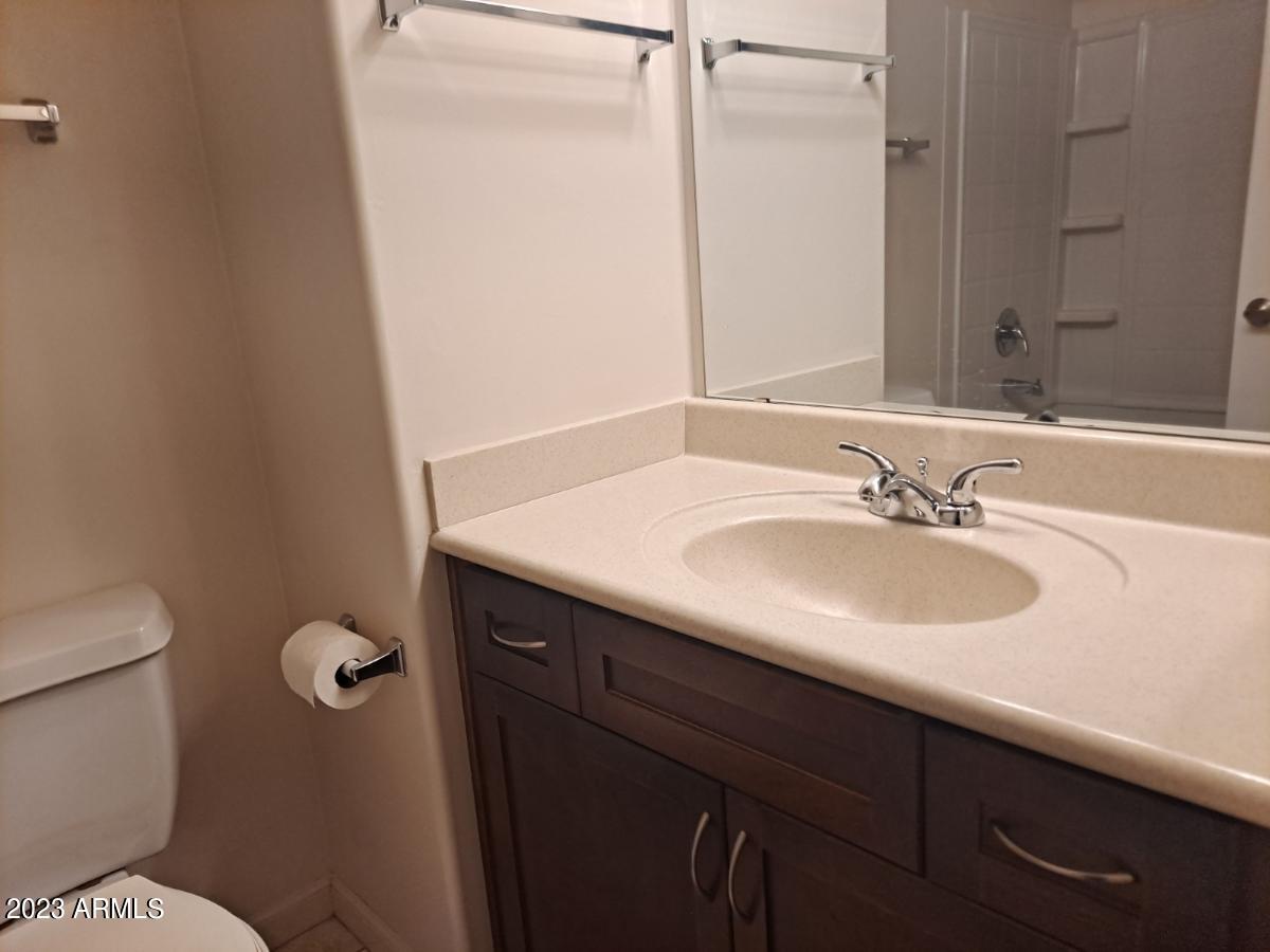 1920 East Bell Road, Unit 1114 Phoenix, AZ 85022 - Photo 16 of 18 a bathroom with a sink and a mirror