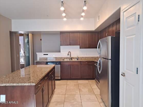 1920 East Bell Road, Unit 1114 Phoenix, AZ 85022 - Photo 3 of 18 a kitchen with stainless steel appliances granite countertop a refrigerator and a sink
