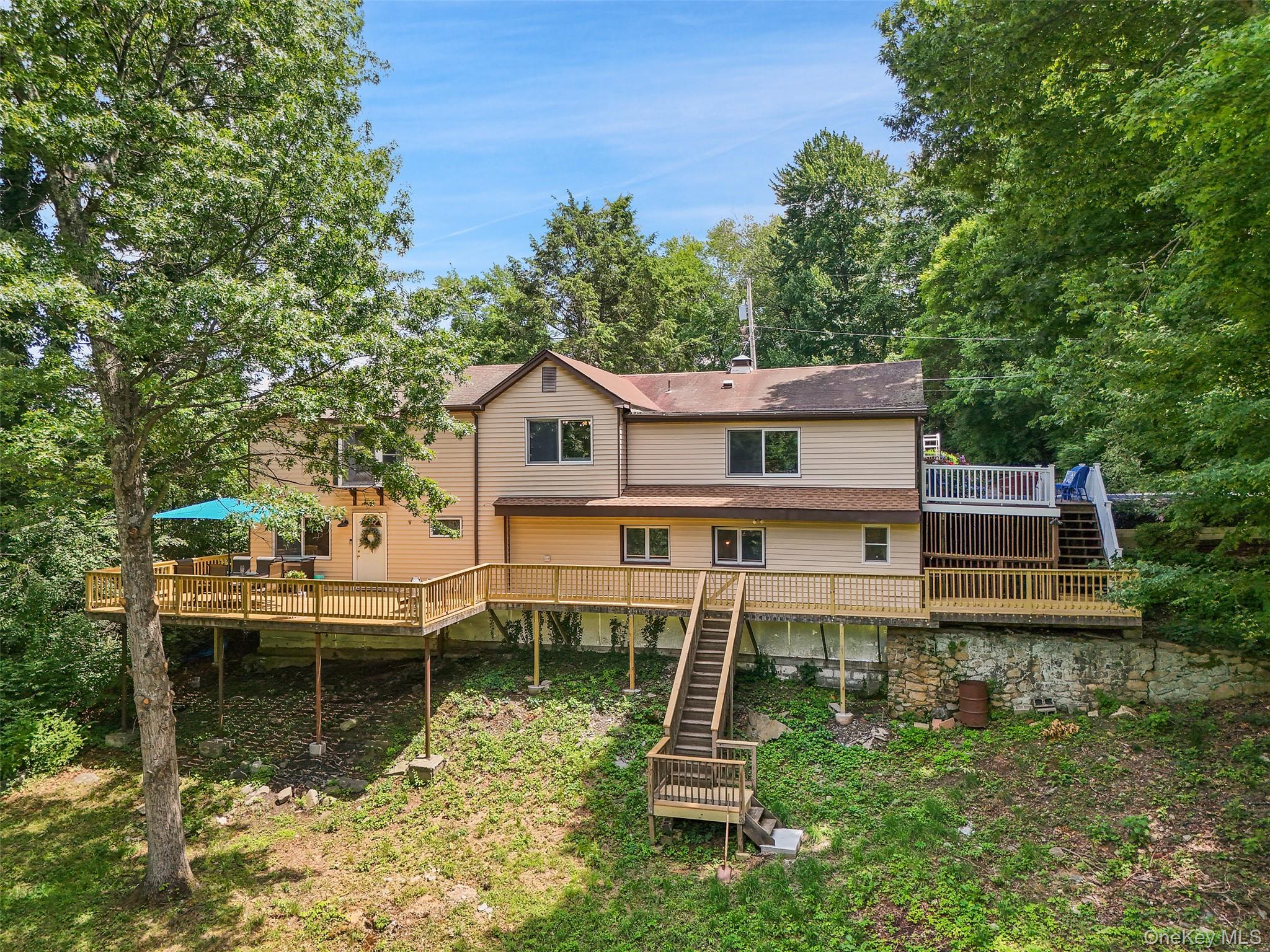 18 Sylvan Road Lake Peekskill, NY 10537 - Photo 4 of 50 Elevated view of the back of the home