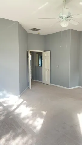 a view of empty room with windows