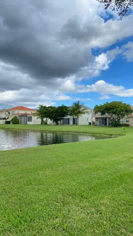 a view of a lake with a big yard