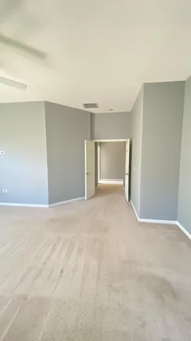 a view of an empty room with a fireplace