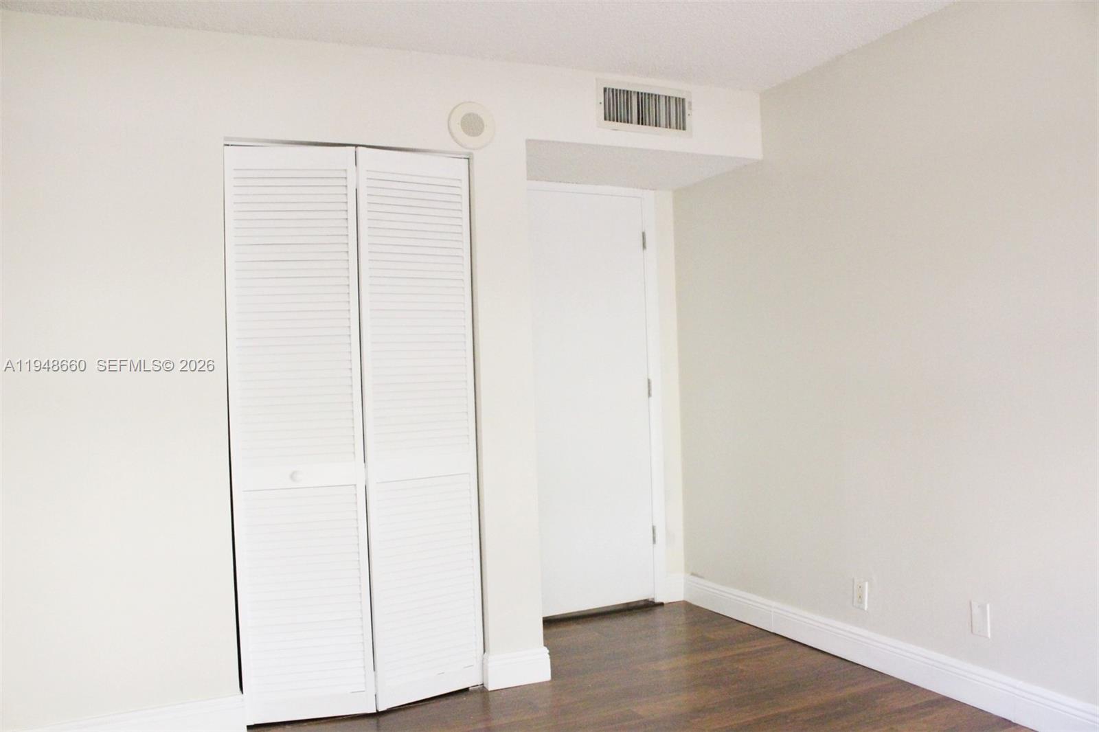 17011 North Bay Road, Unit 202 Sunny Isles Beach, FL 33160 - Photo 12 of 32 a view of small space with wooden floor