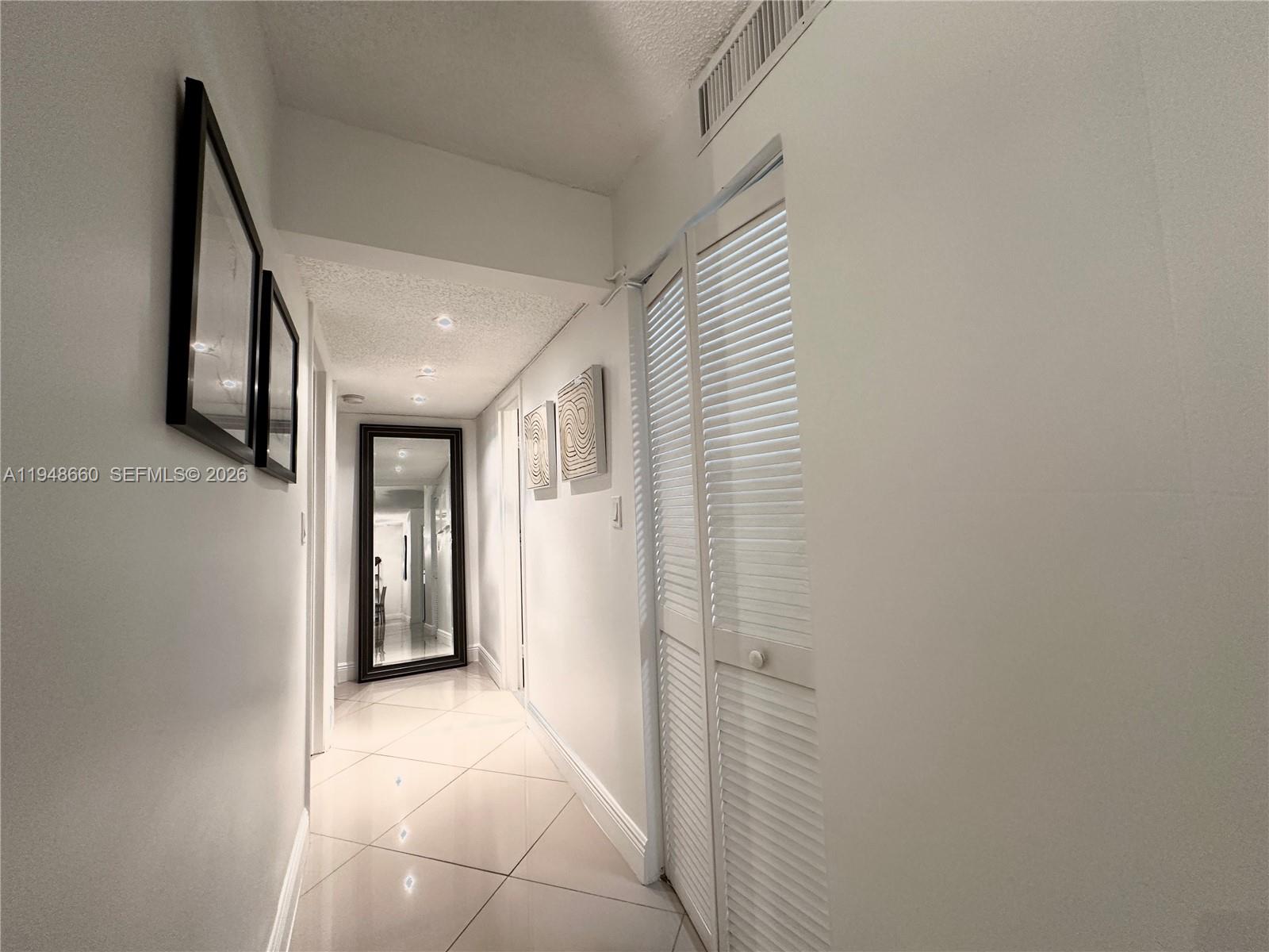 17011 North Bay Road, Unit 202 Sunny Isles Beach, FL 33160 - Photo 20 of 32 a view of a hallway with entryway