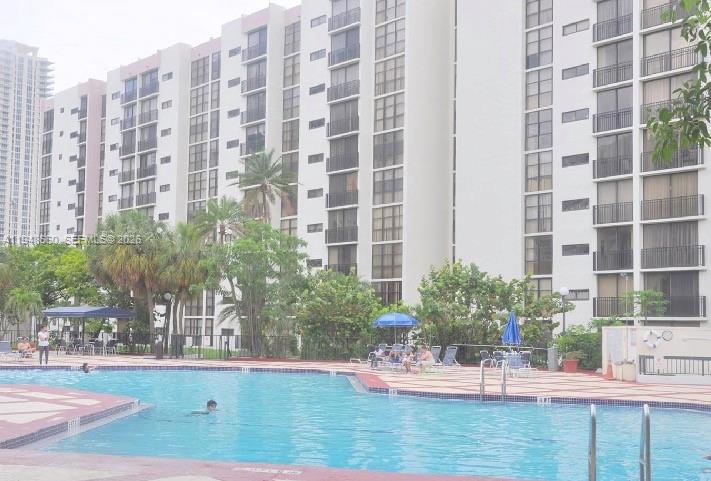 17011 North Bay Road, Unit 202 Sunny Isles Beach, FL 33160 - Photo 28 of 32 a view of pool with outdoor seating