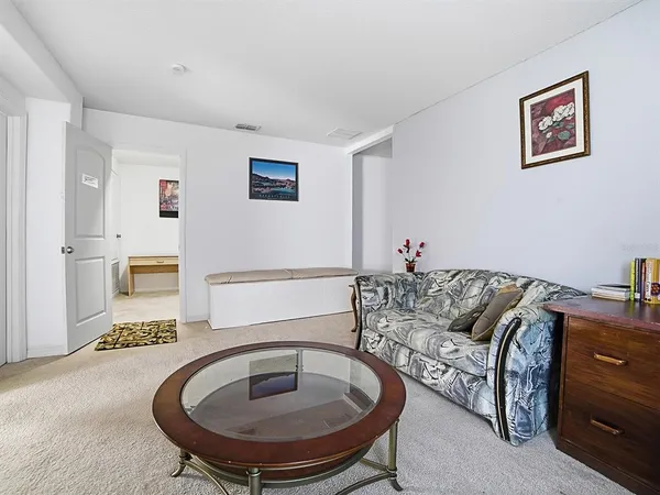 a bedroom with a bed and a dresser in it