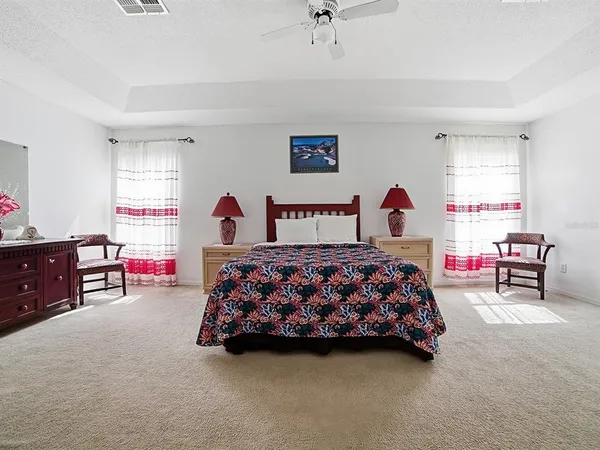 a bedroom with a bed and a cabinets