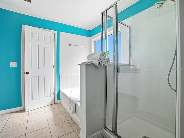 a bedroom with bed and window