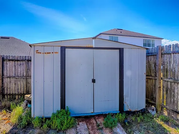 an aerial view of a house with a swimming pool