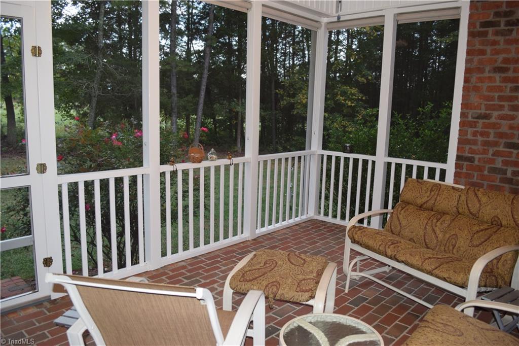 149 Live Oaks Road Advance, NC 27006 - Photo 5 of 24 Enjoy the outdoors on the screened-in porch!