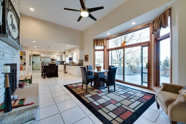 a bedroom with a bed window and a ceiling fan