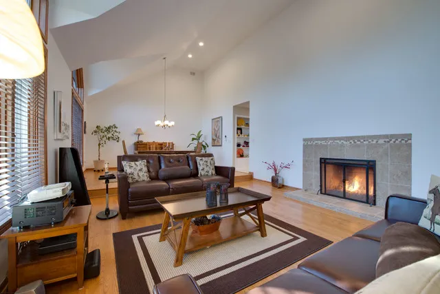 a bathroom with a granite countertop sink mirror and a bathtub