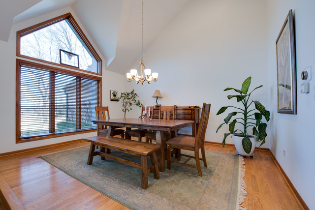 14080 West Old School Road Mettawa, IL 60048 - Photo 14 of 64 a dining room with furniture a potted plant and a rug