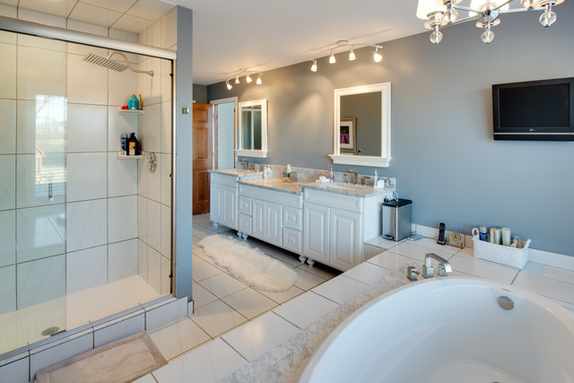 14080 West Old School Road Mettawa, IL 60048 - Photo 17 of 64 a bathroom with a tub a double vanity sink a mirror and shower
